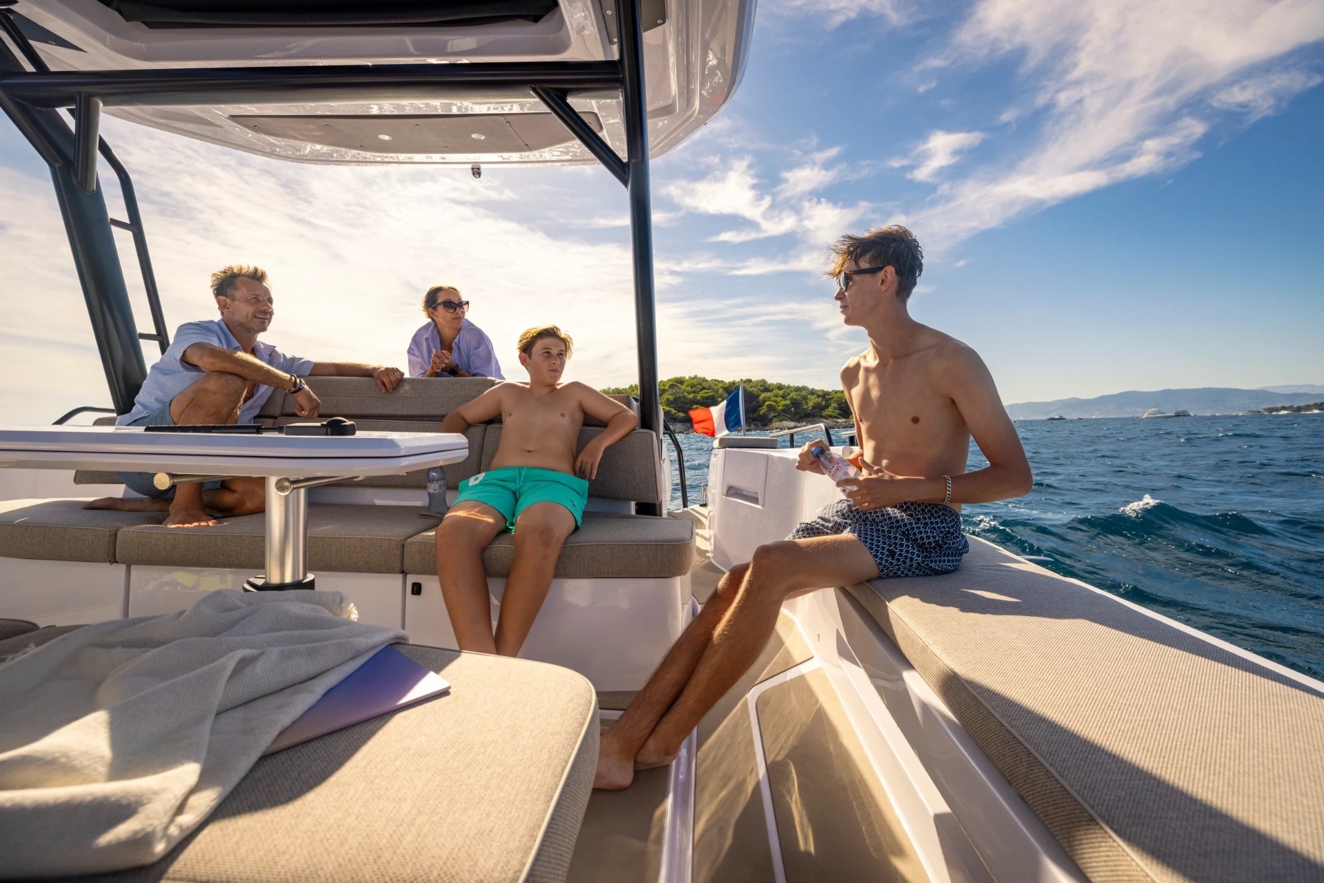 Group of guests relaxing in the shaded cabin seating area