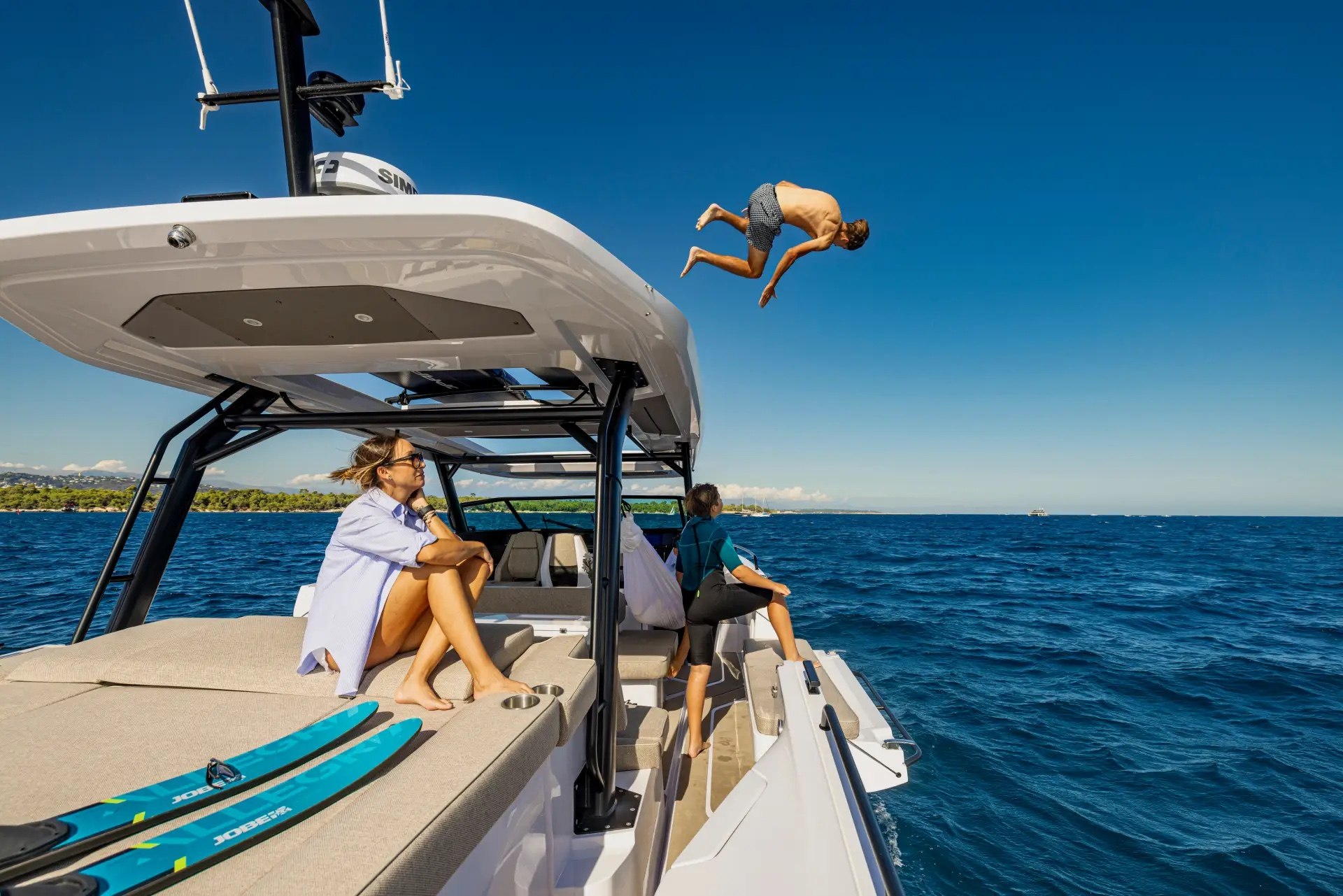Guest leaping from the roof of the Axopar 45 Cross Top into the Mediterranean